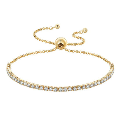Gold bracelet with diamond accents on a white background