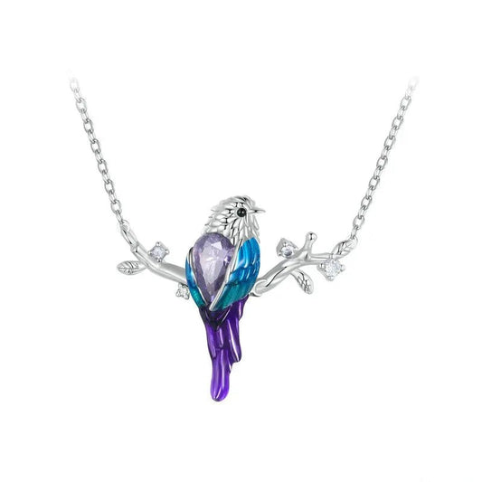 Bird-shaped necklace with a purple and blue design on a white background