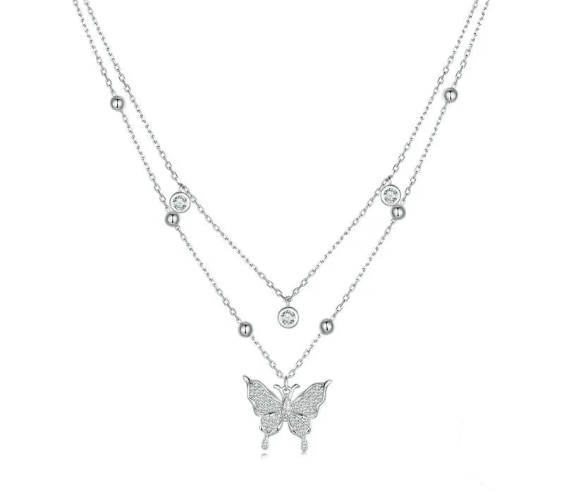 Silver butterfly necklace on a white background