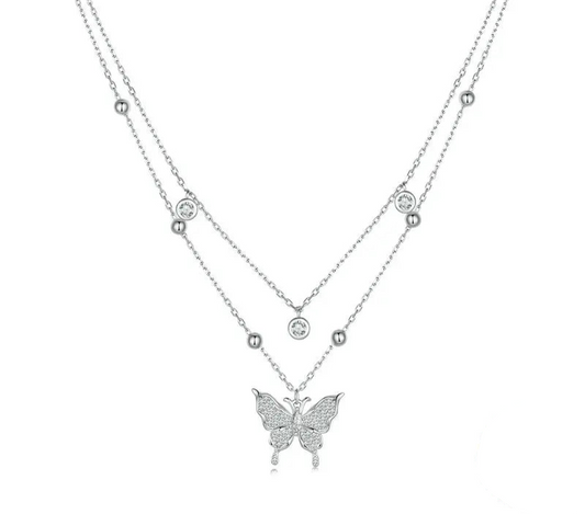 Silver butterfly necklace on a white background