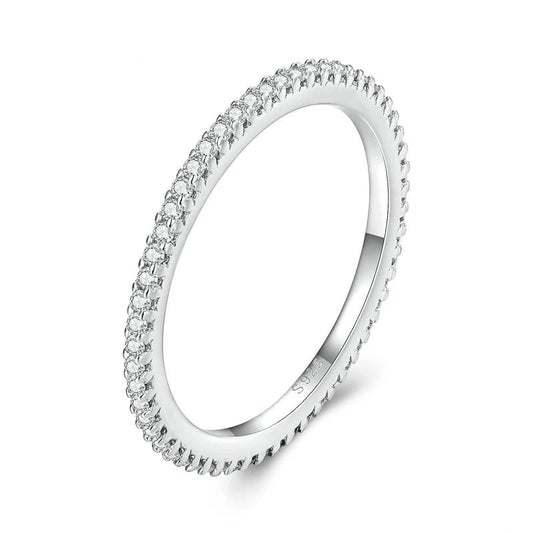 Silver ring with small diamonds on a white background
