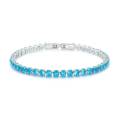 Silver bracelet with blue gemstones on a white background