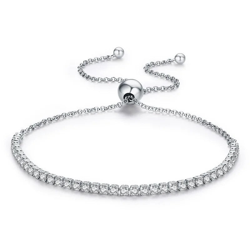 Silver bracelet with clear stones on a white background