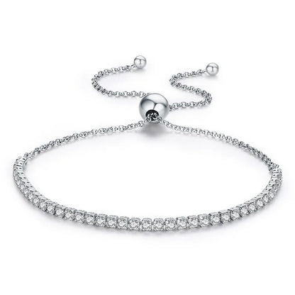 Silver bracelet with clear stones on a white background