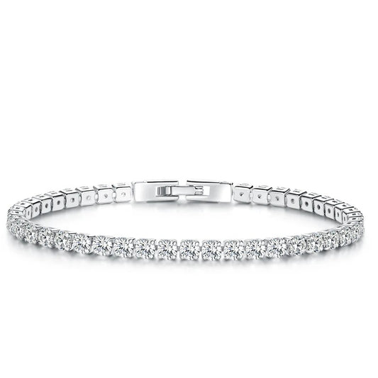 Silver bracelet with clear stones on a white background