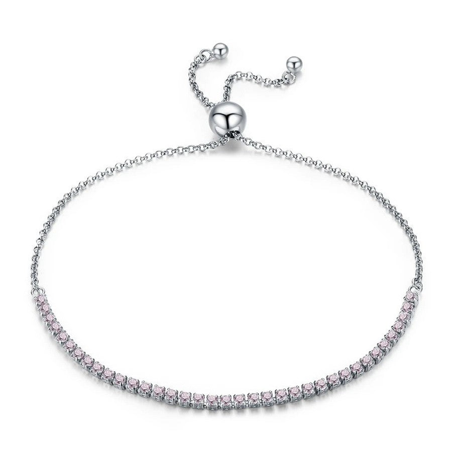 Silver bracelet with pink stones on a white background
