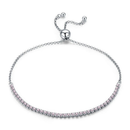 Silver bracelet with pink stones on a white background