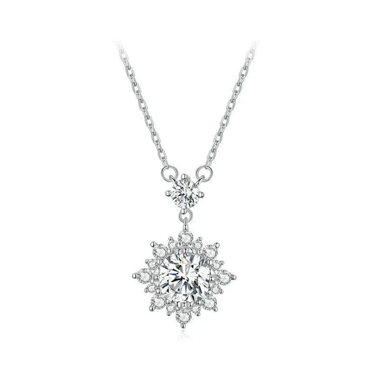 Silver necklace with a snowflake-shaped pendant on a white background
