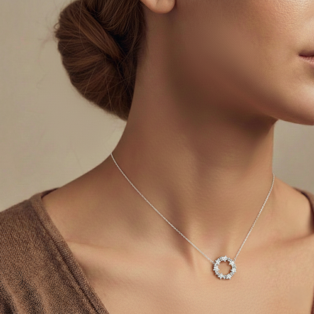 Necklace with a circular pendant worn by a model against a neutral background