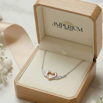 Heart-shaped necklace in a 'Imperium Jewels' box with a soft background