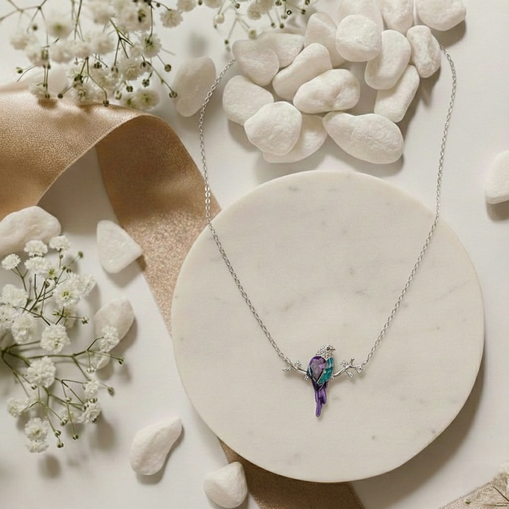 Necklace with a butterfly pendant on a marble surface with flowers and stones