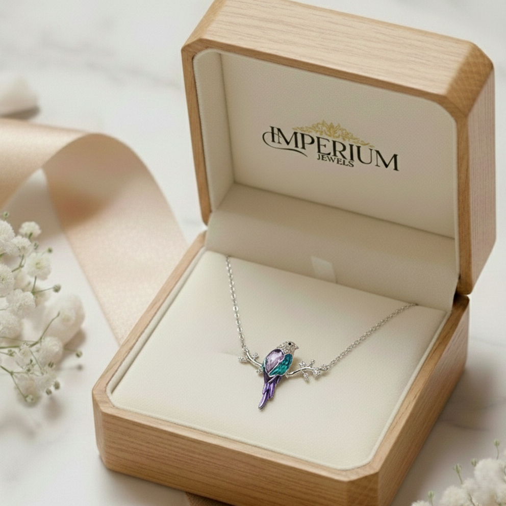 Jewelry box with a necklace featuring a colorful pendant, branded 'Imperium Jewels'.