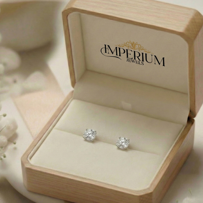 Diamond stud earrings in a 'Imperium Jewels' box on a soft background