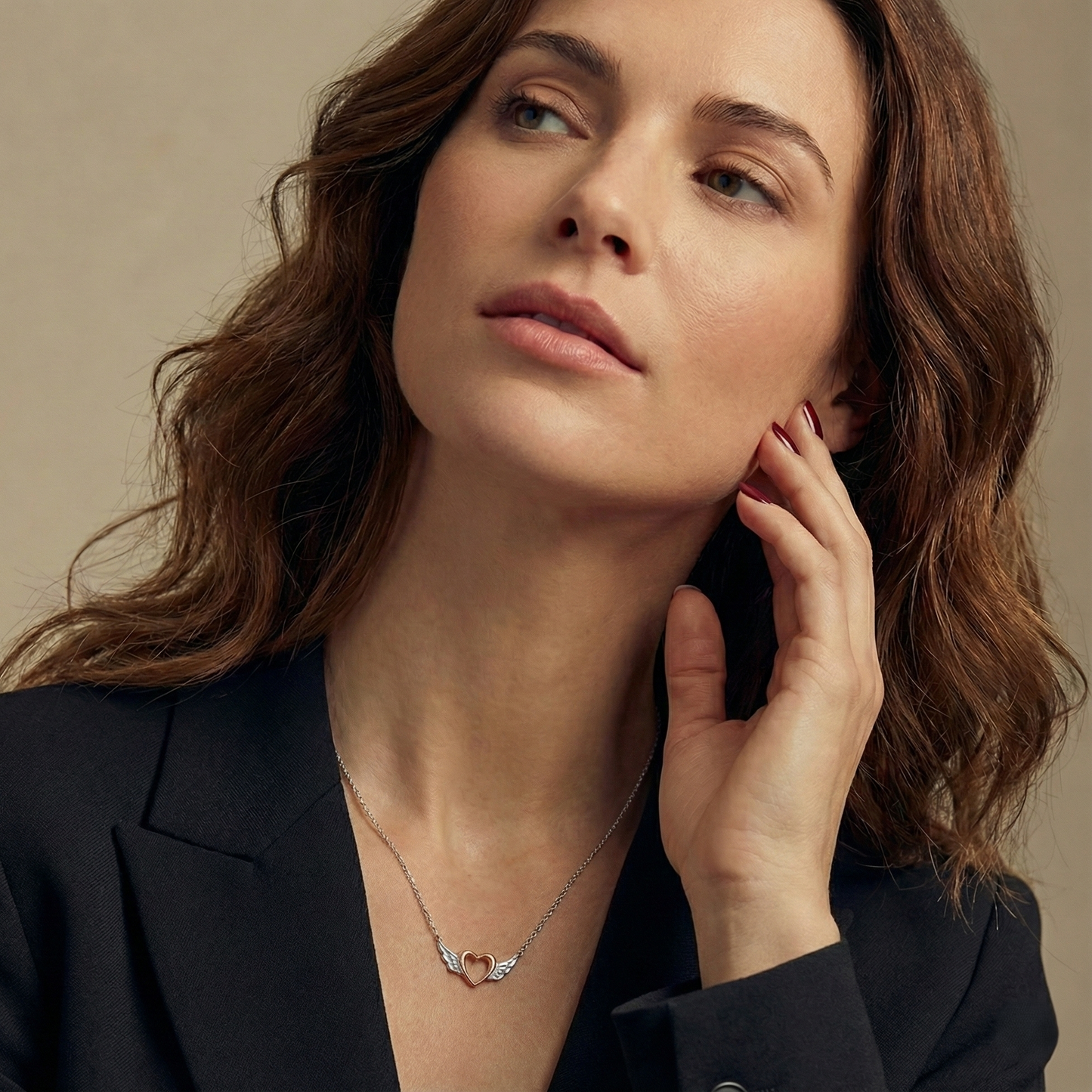 Woman wearing a necklace with a subtle background