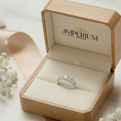 Silver ring in a wooden jewelry box with 'Imperium Jewels' branding.