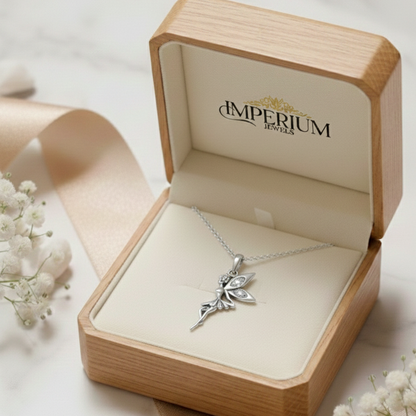Silver fairy pendant necklace in an open 'Imperium Jewels' box with white flowers around.