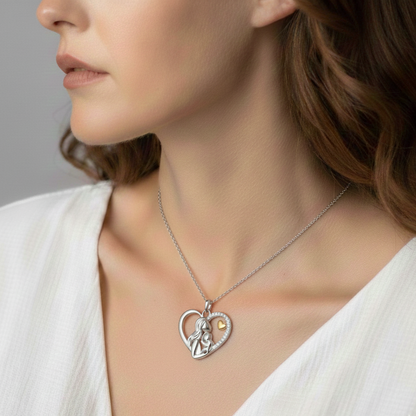 Silver mother and child heart necklace worn to show pendant length and shine.