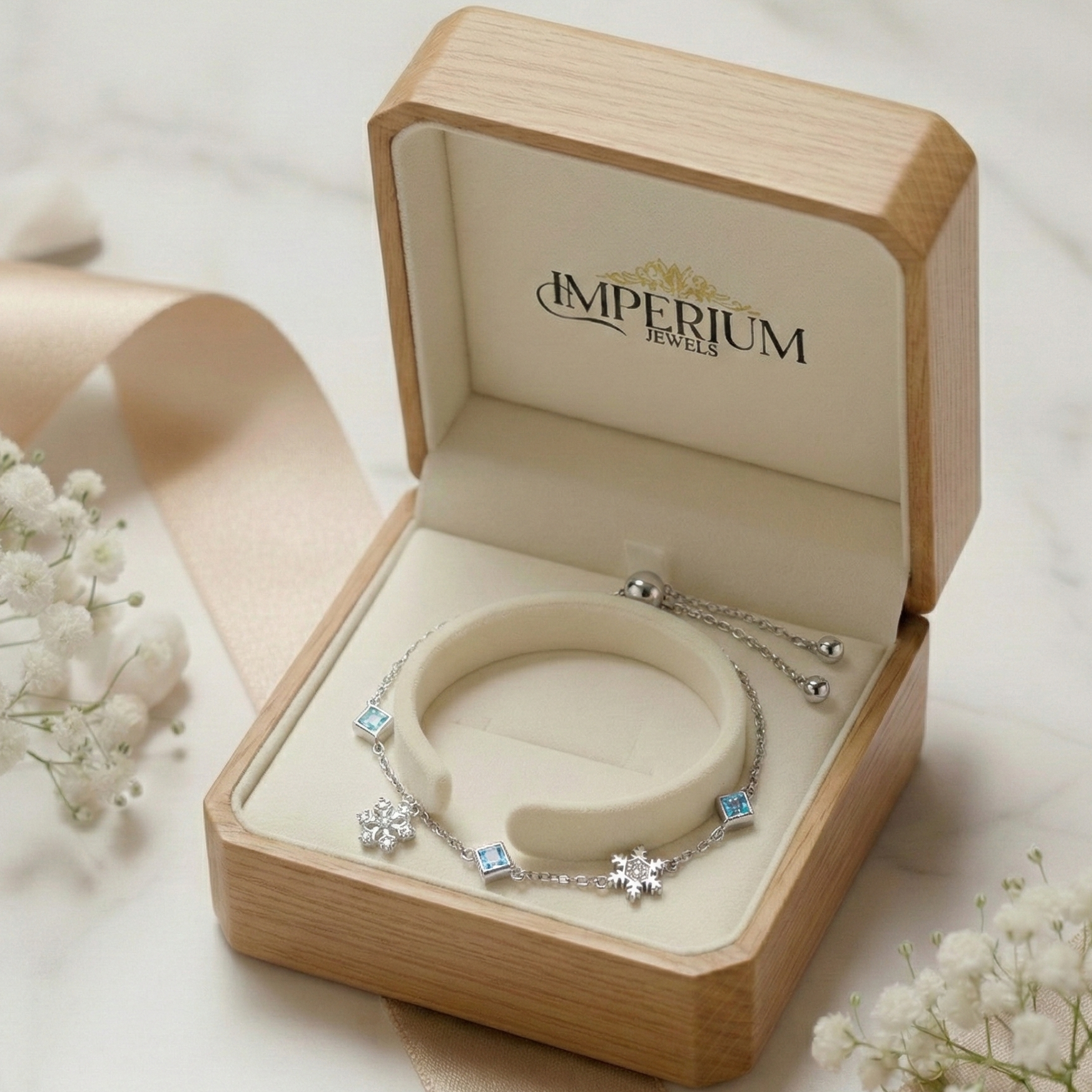 Open jewelry box with a bracelet inside, featuring the 'Imperium Jewels' brand.