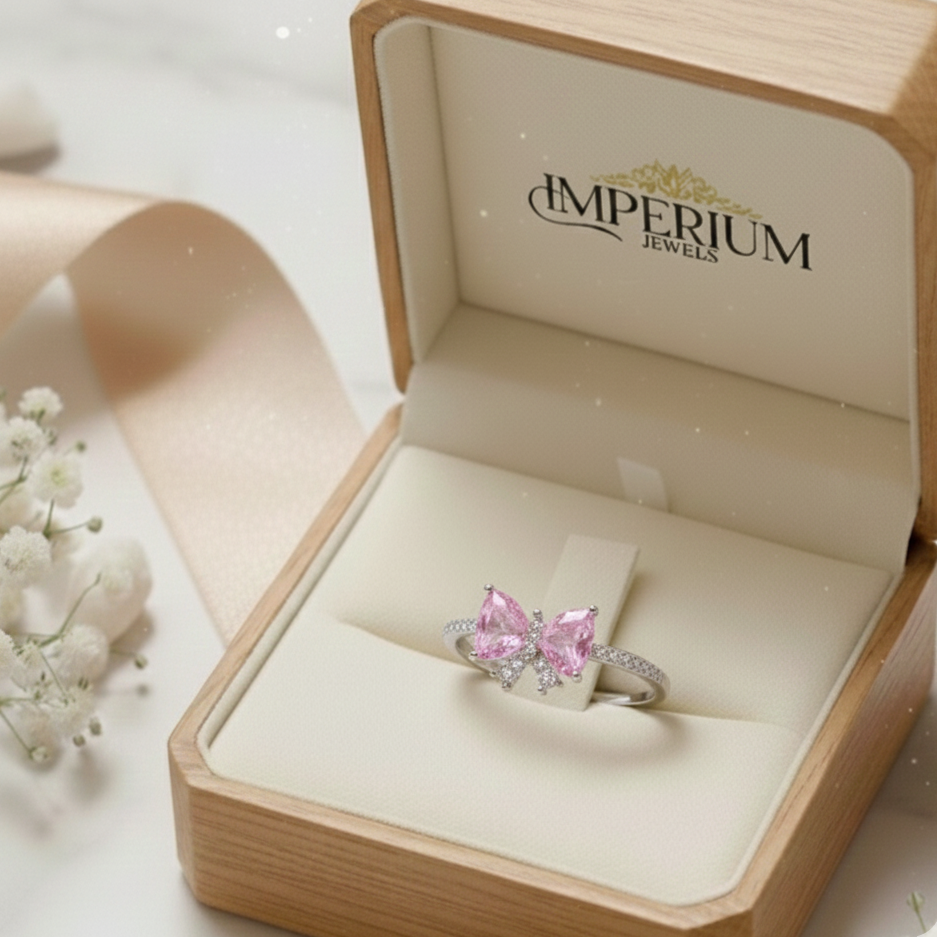 Pink gemstone ring in a 'Imperium Jewels' box with a soft background