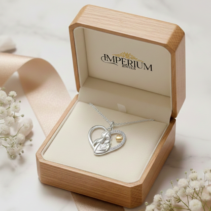Heart-shaped silver necklace with a gold heart charm in an open wooden box with 'Imperium Jewels' branding.
