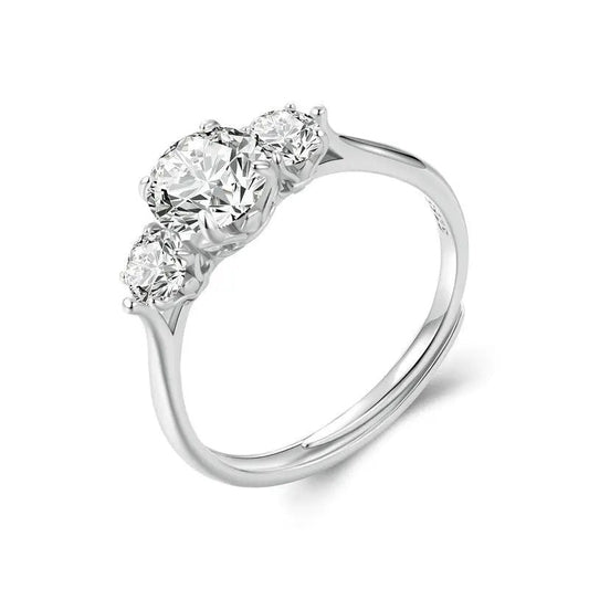 Diamond ring with three stones on a white background
